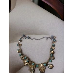 Beautiful vintage blue and gold charm necklace